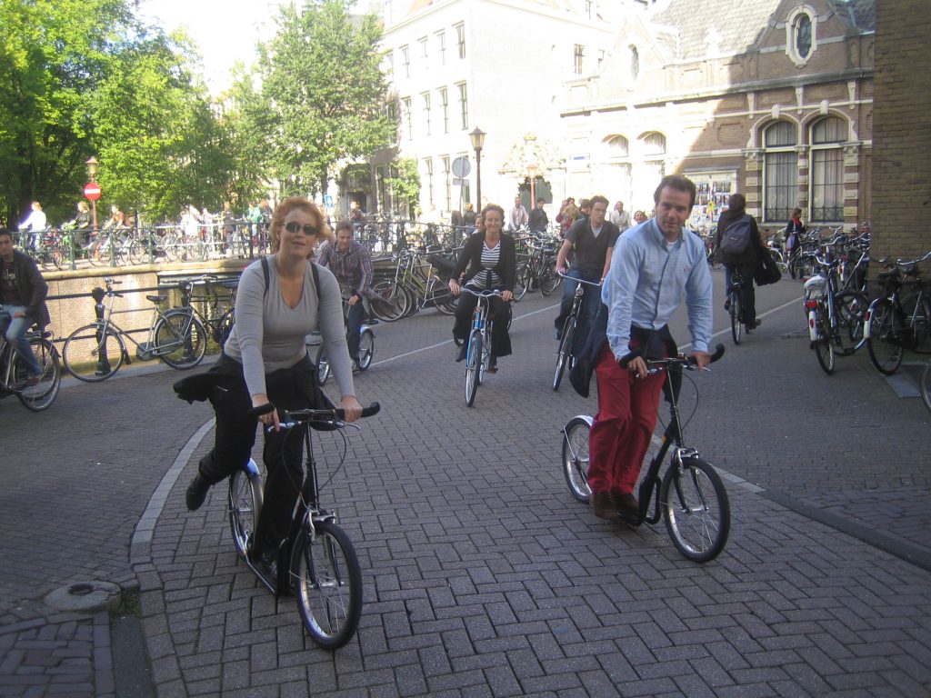 Business people scooting in Amsterdam