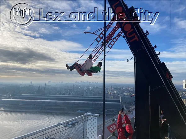 The pic shows a swing where you sit side by side on the 20th floor, (on the roof!) looking out over the river 't IJ and the Amsterdam. - A'dam Tower