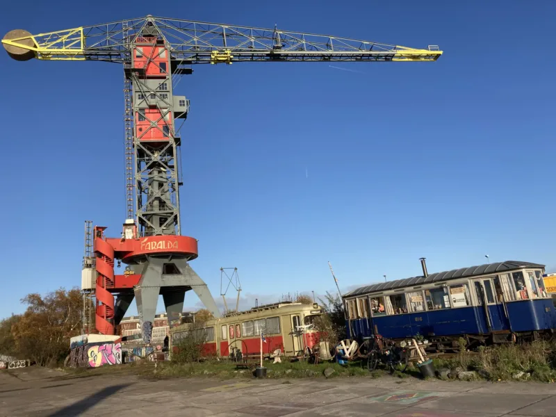 The raw and recycled side of the NDSM Wharf with the Trammeland trams and the Crane Hotel - Picture by Lex and the "Noord" tours